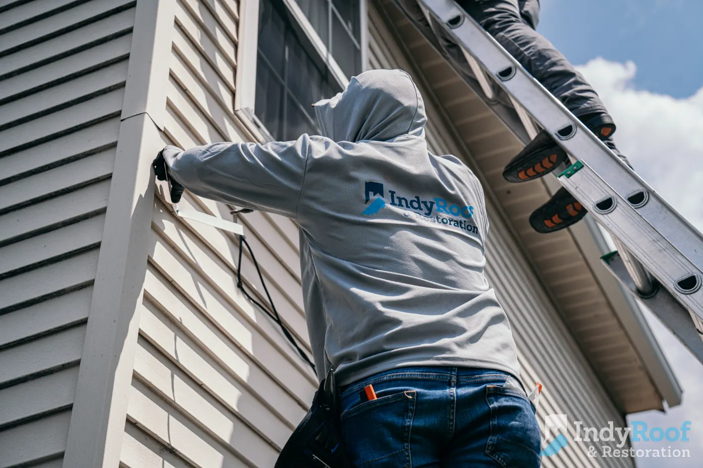 Siding installation documented in Holliday Farms